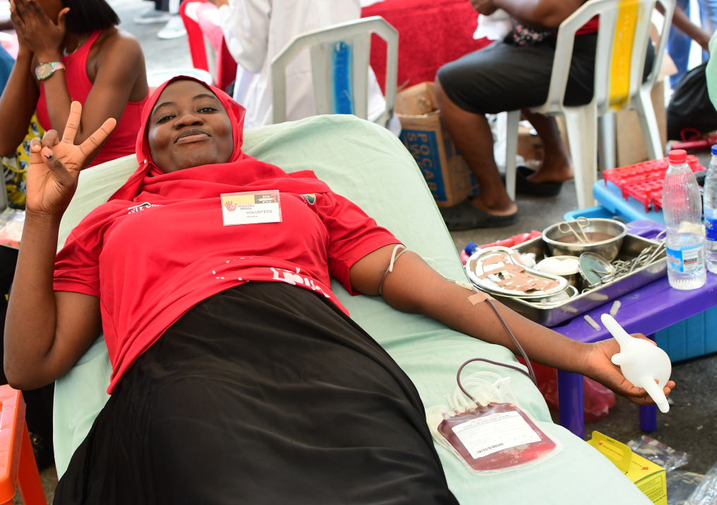 A volunteer donating blood at an SCFN blood drive.