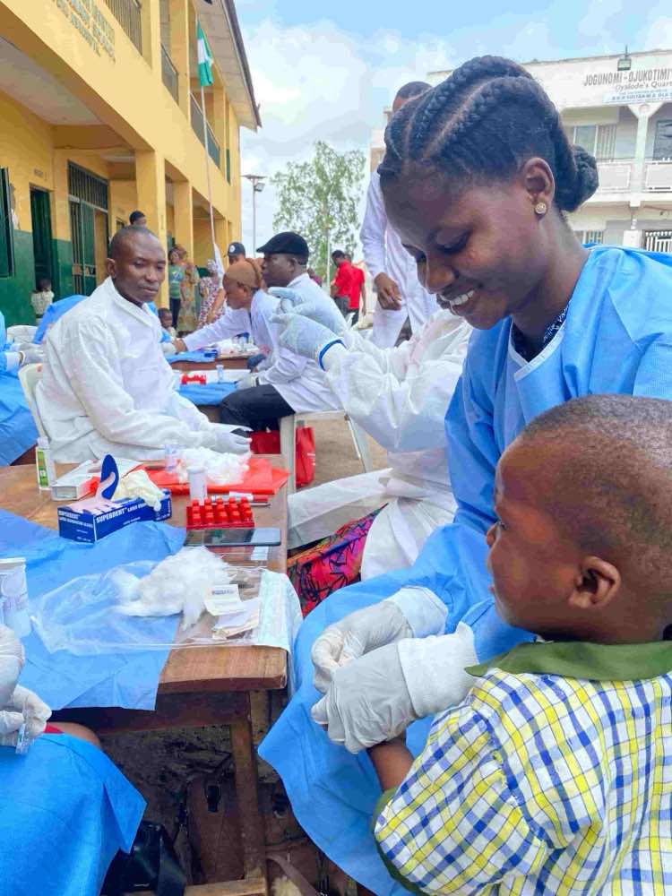 Laboratory blood sample handling and microscopy preparation.