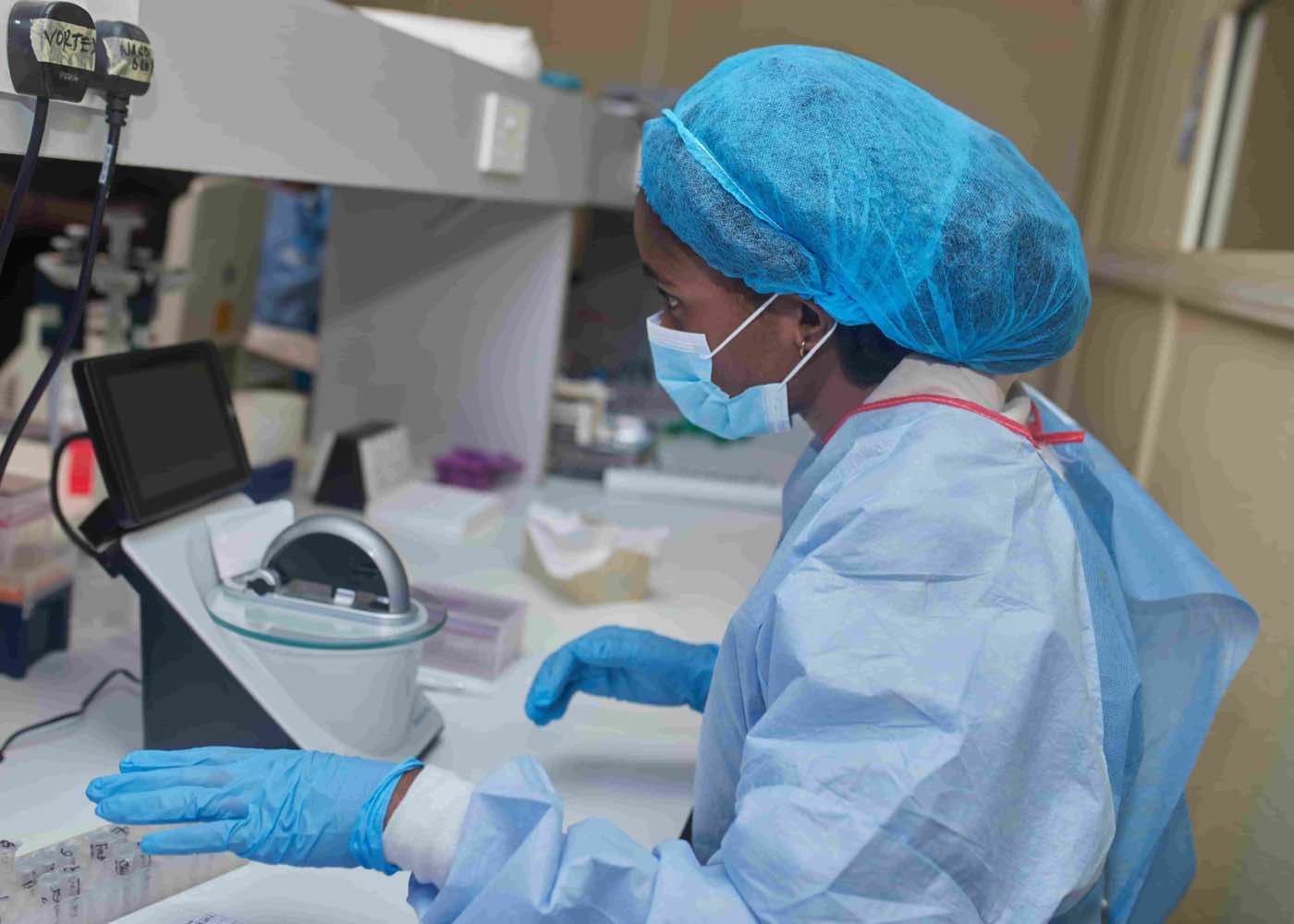 Lab specialist executing molecular diagnostics workflow.