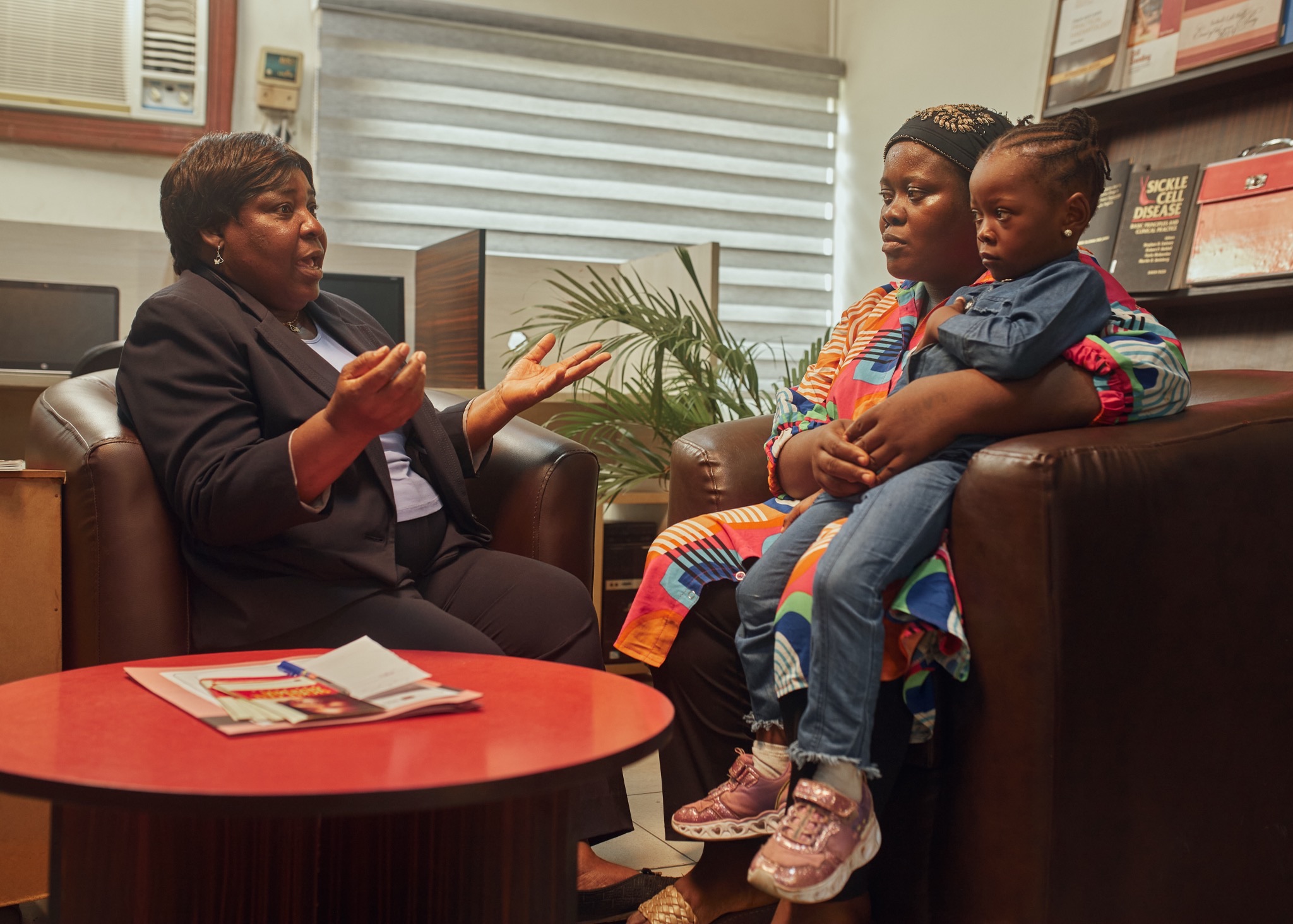 Counseling session with a family receiving guidance and emotional support.